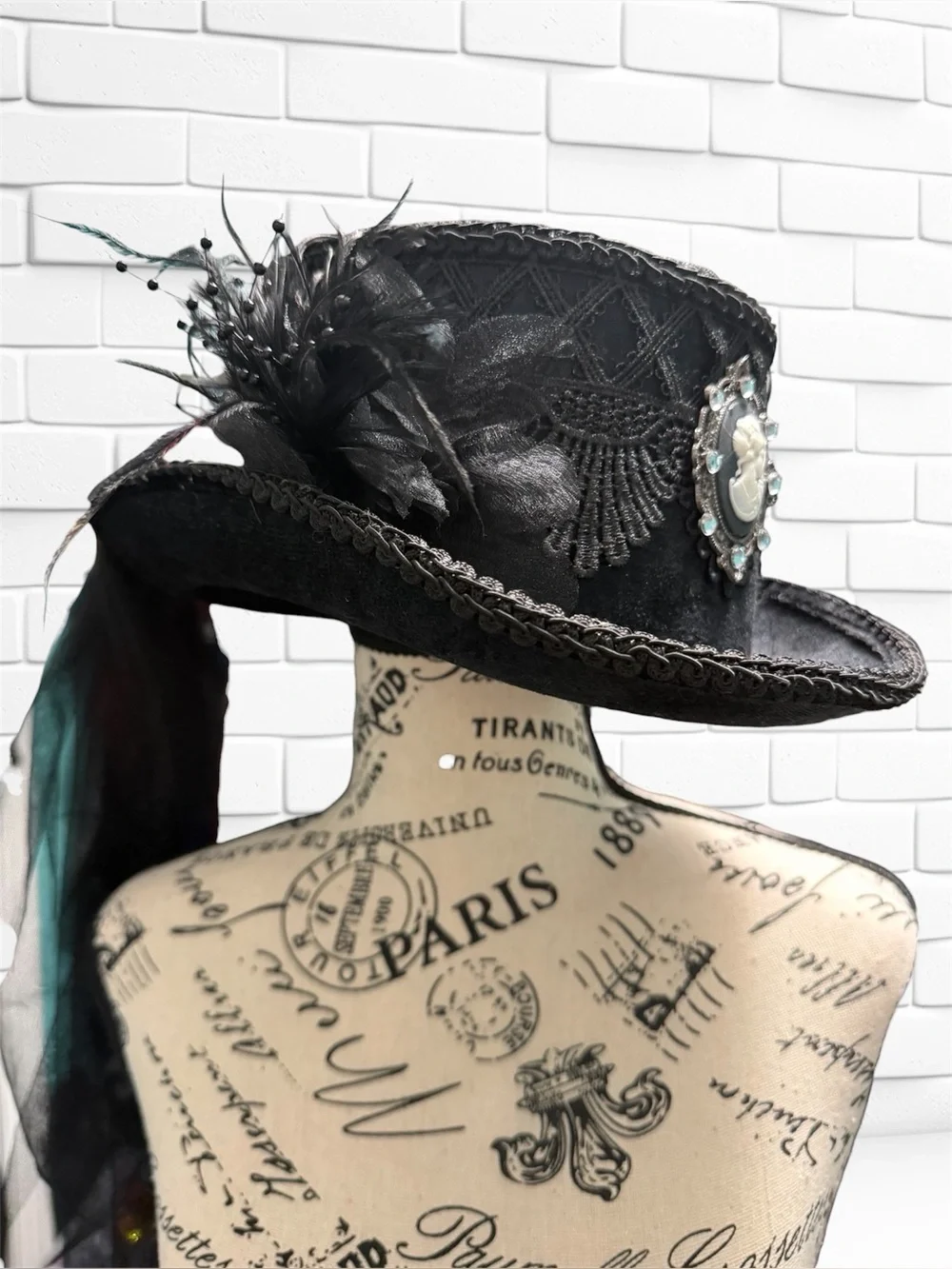 Elegant Black Feathered Steampunk Hat with Cameo Accent